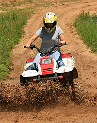 ATV rider on a dirt path