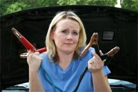 woman with jumper cables