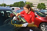 Safelite tech repairing windshield