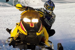 man riding snowmobile 