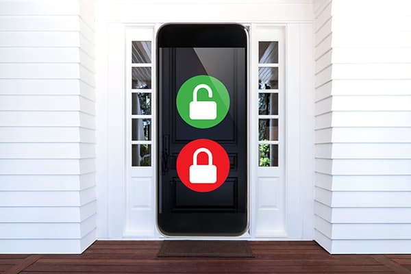 A cellphone in place of the front door of a home, the screen displays an unlocked padlock with a locked padlock below it.