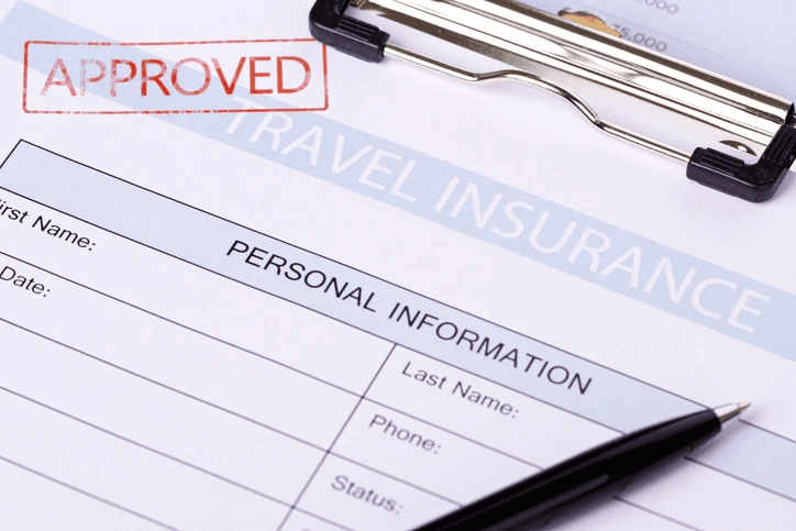 Travel Insurance form with 'Approved' stamped on it.