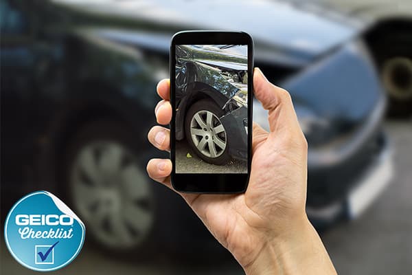 Taking photos on smartphone of a car accident.