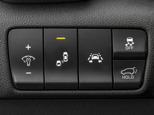 Close up of buttons on a vehicle control panel.