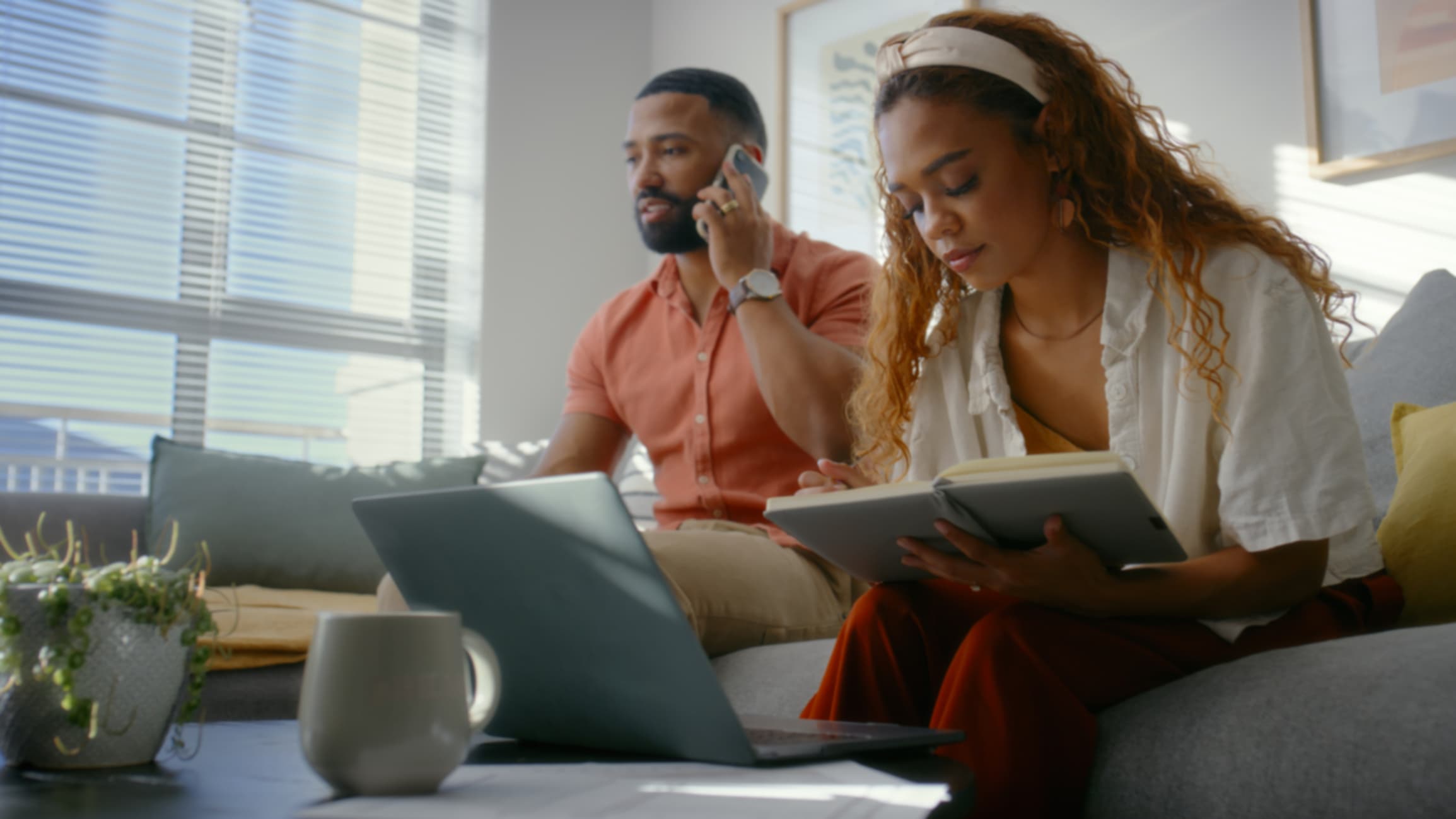 Couple reviewing home insurance details together while switching policies.