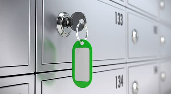 Safety deposit box with a key in the lock.