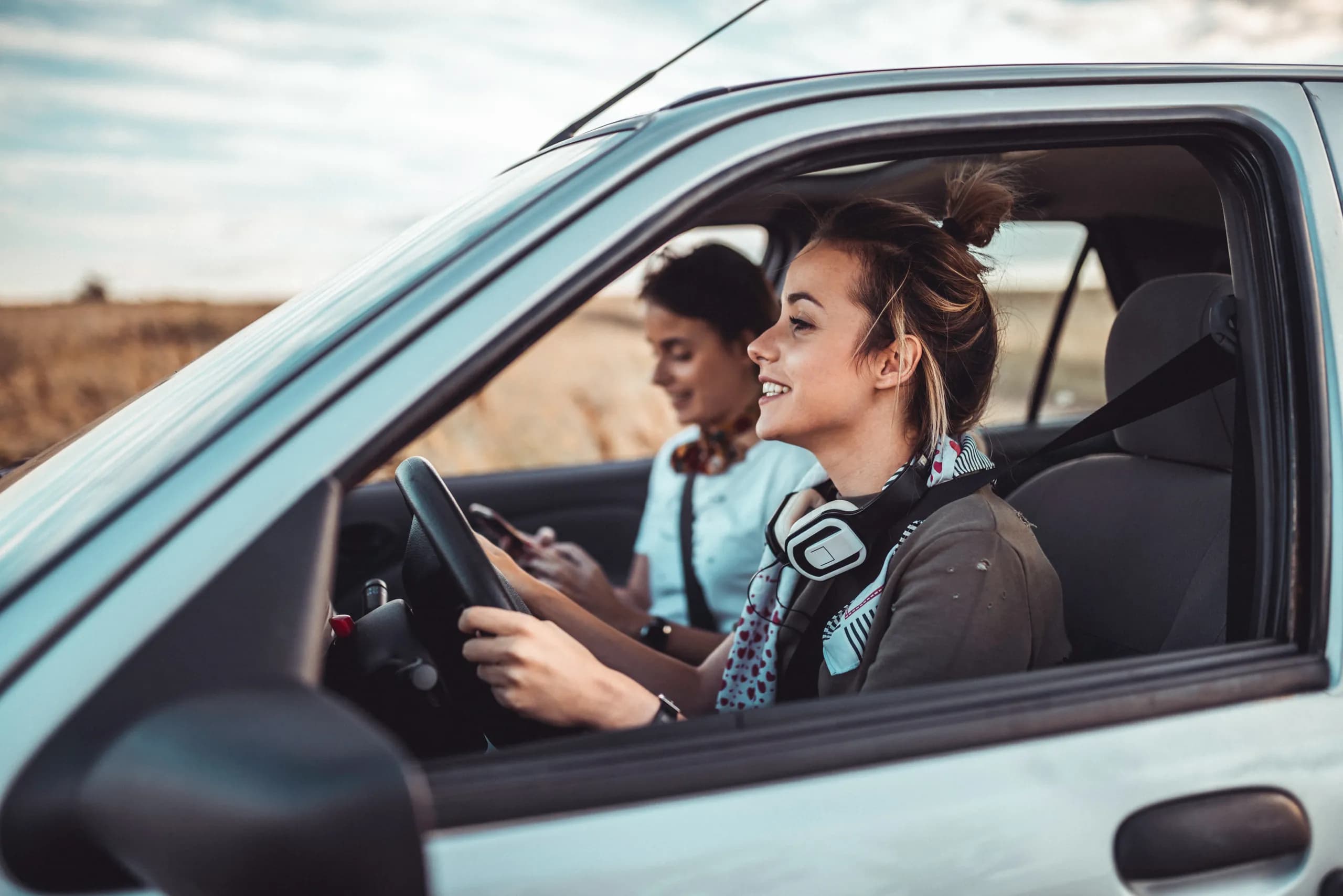 Friends driving in the countryside.