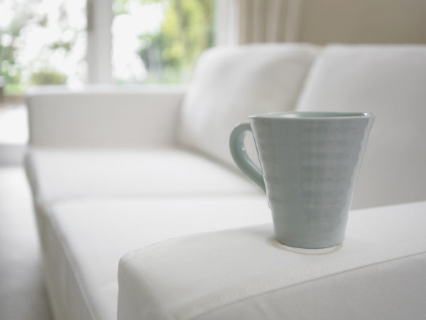Close up of coffee cup on sofa