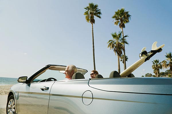 Couple drivinga car in California