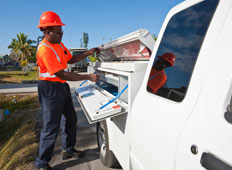 Man with commercial vehicle at a work site.