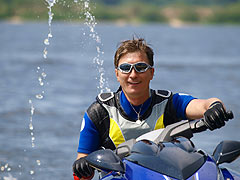 man riding jet ski