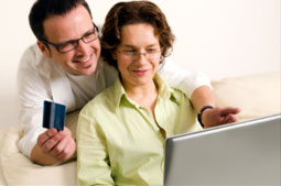 man and woman making a payment on their laptop