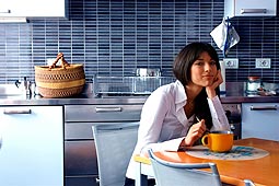 woman sitting at kitchen table