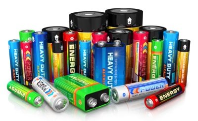 Large assortment of different types of batteries.