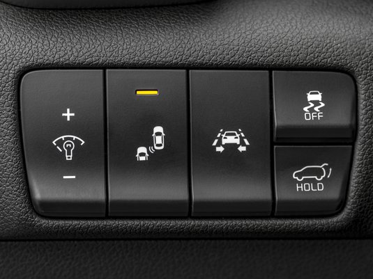 Close up of buttons on a vehicle control panel.