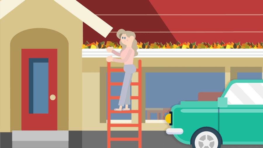 Woman on a ladder, in front of her house, cleaning out gutters overflowing with leaves.
