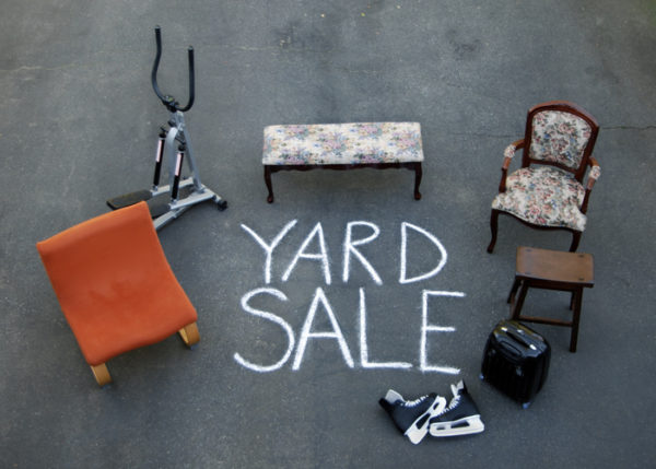 Items you might see at a garage sale: hockey skates, furniture, old exercise equipment.
