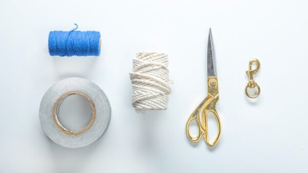 Macrame' rope, twine, metal latch, tape, and scissors.