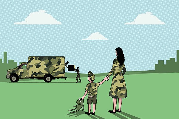 A mother and son watching movers pack up boxes in a moving truck.