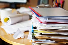 stack of papers on a desk