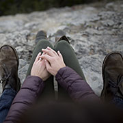 couple sitting on rock