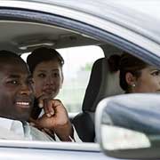 group of people riding in a car