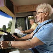 older couple driving RV