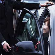 man helping woman out of car